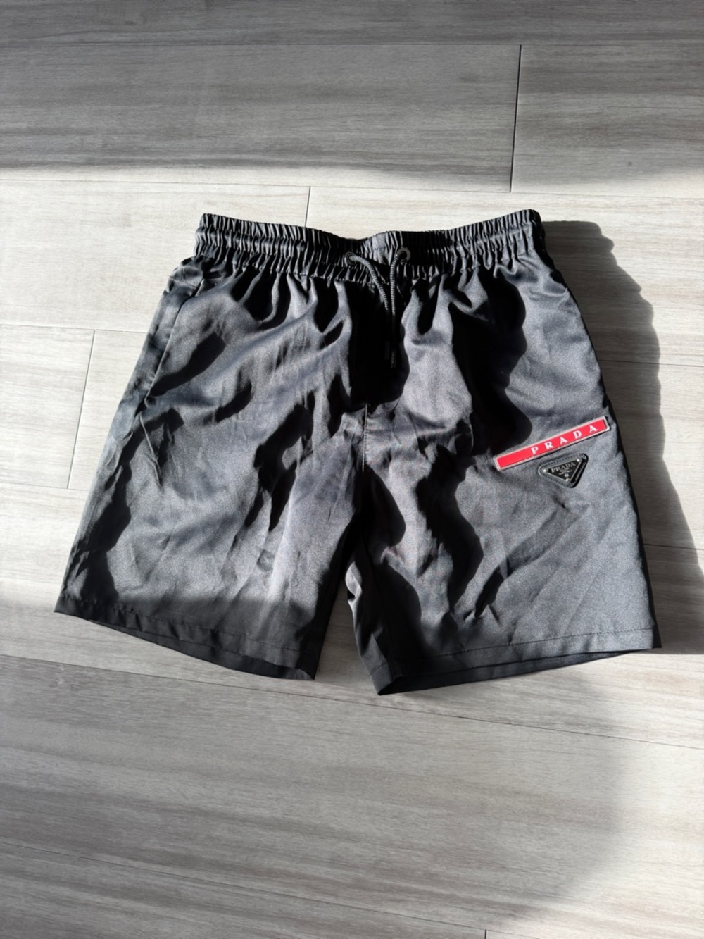 Prada Black Nylon Swim Shorts with Red Logo Stripe